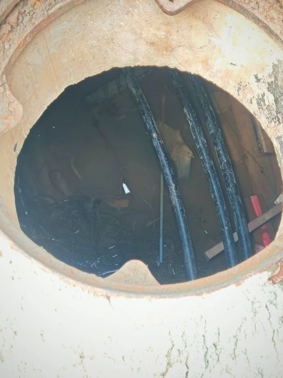 Open underground chamber showing the internal cables and field environment